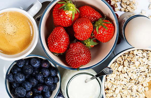 Healthy breakfast - yogurt with muesli and berries - health and diet concept; Shutterstock ID 192051983